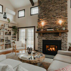 a living room filled with furniture and a fire place
