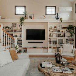 a living room filled with furniture and a flat screen tv
